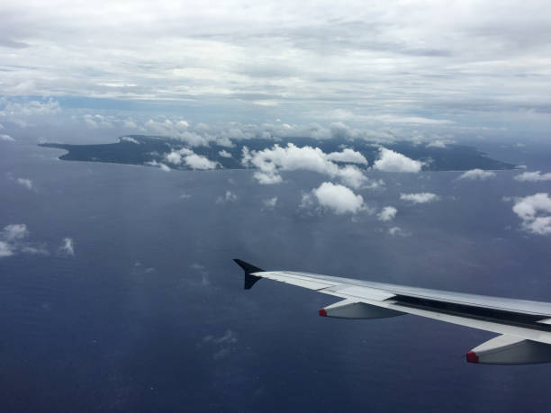 View of the Island of Niue in the South Pacific from the plane. Aerial view of the arrival on the island also known as the rock of Polynesia.