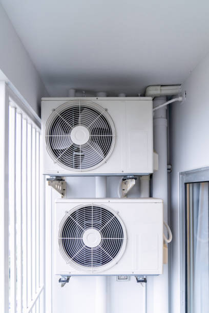 istock two air conditioning compressors are hung on wall. 1288100592