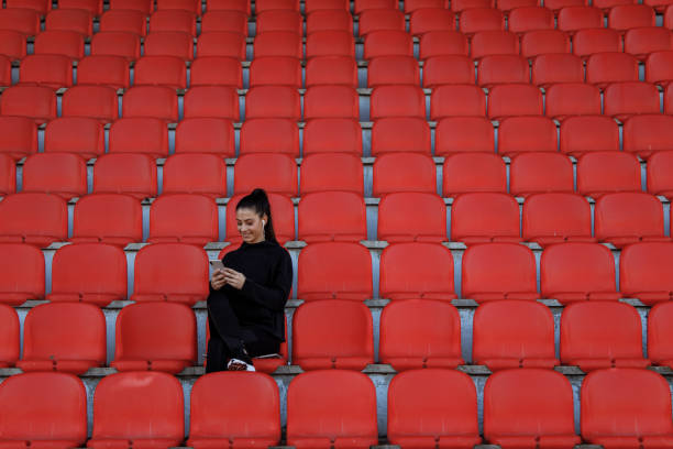 istock Fit girl resting alone, chatting with someone. 1288103039