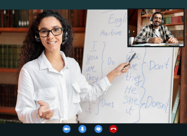 istock English teacher explaining lesson to indian man, talking to camera 1288103224
