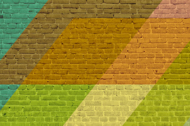 istock Brick wall painted with multi-colored paints. Abstract background. The old wall. 1288104809