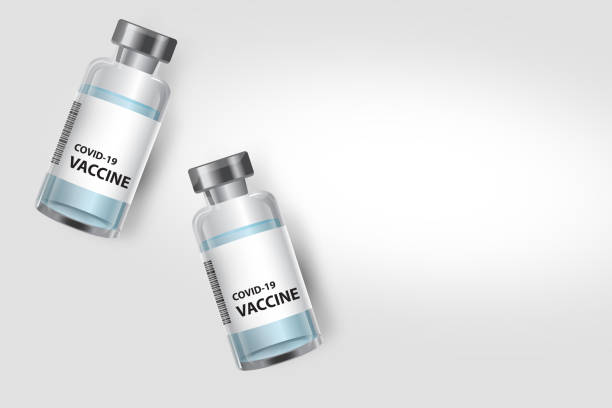 istock Corona Virus Vaccine bottles on banner with copy space 1288104841