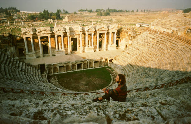 istock Man looking at ancient Rome theatre in Pamukkale 1288108489