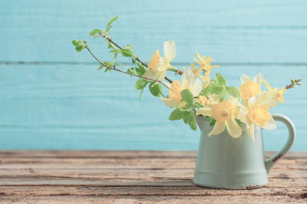 istock yellow spring flowers on old wooden background 1288111239