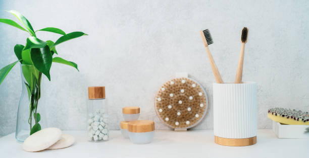 istock Zero waste bathroom items. Bamboo toothbrushes, natural mouth washing tabs, soap, loofah pads, creams, and wooden body brush. Natural body care essentials. Eco-friendly self-care. Wide banner. 1288113262