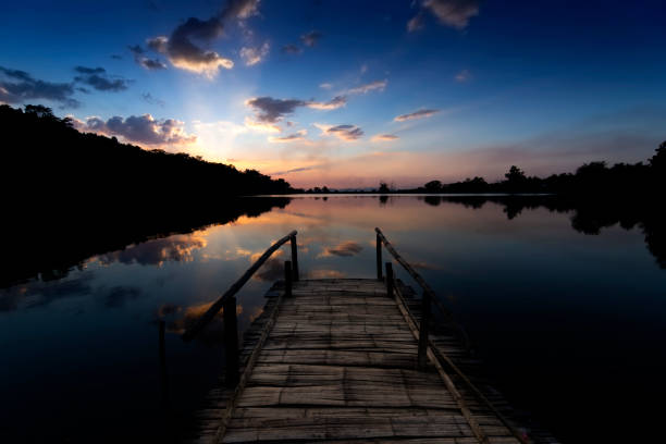 Bamboo bridge By the lake at sunset in thailand, New year corridor ideas 2021