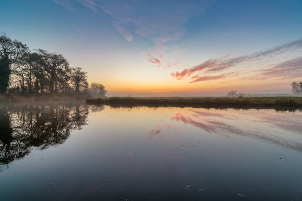 Dutch polder landscape with colorful sunrise