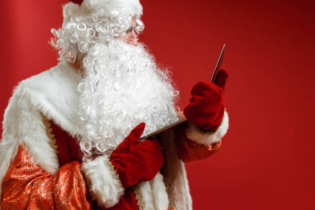 istock Santa Claus talks to a child via video link while spending the holiday online. 1288115821