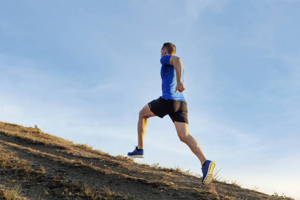 istock male athlete runner run mountain trail 1288117320