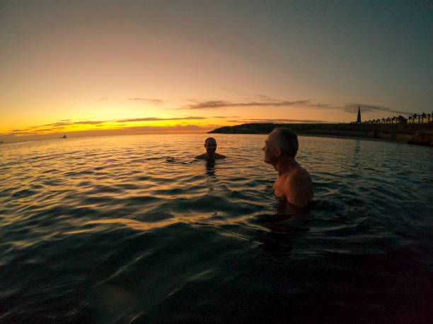 istock Swimming in the Sea During Sunrise 1288118573