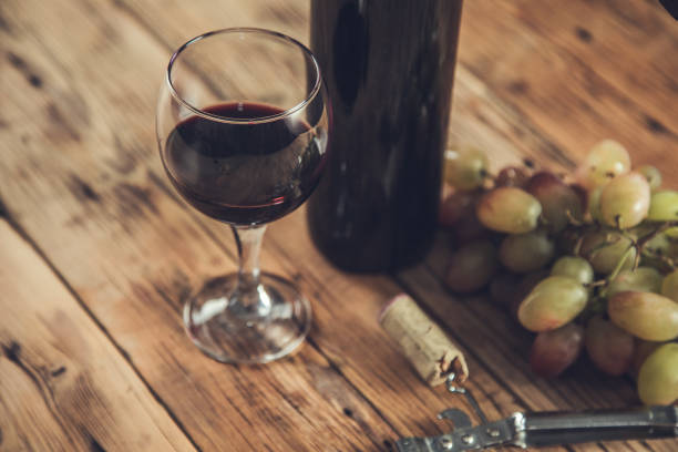 istock grapes wine bottle and glass with opener 1288123028