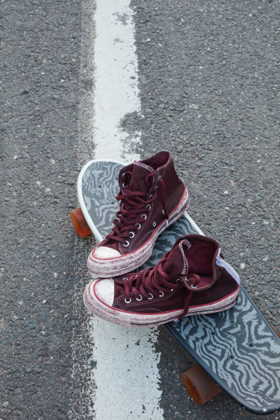 istock Used shoes and skateboard 1288123991