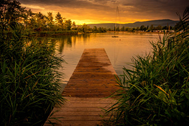 camping ground on a quiet lake with a fountain