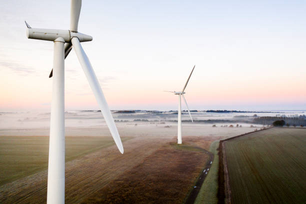 istock Two wind turbines at sunrise 1288128168