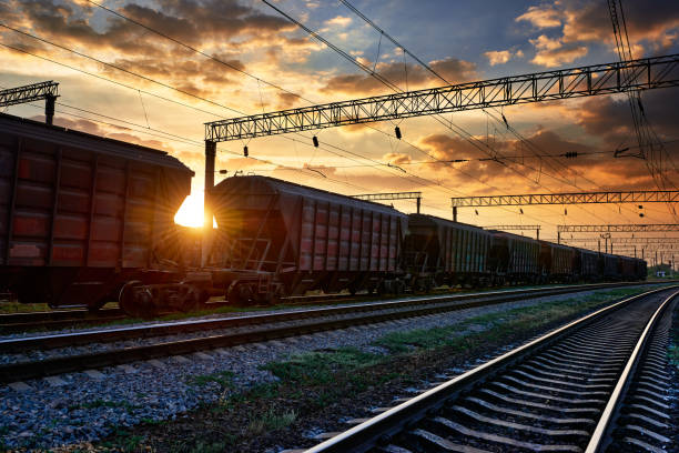 istock railway and rail cars in a beautiful sunset, dramatic sky and sunlight 1288128807