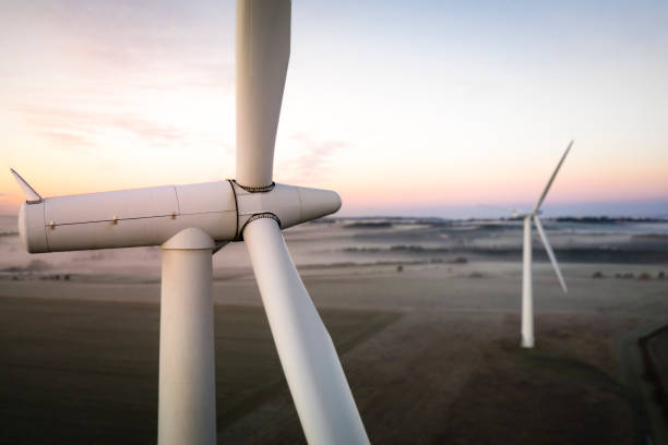 istock Two wind turbines at sunrise 1288128817