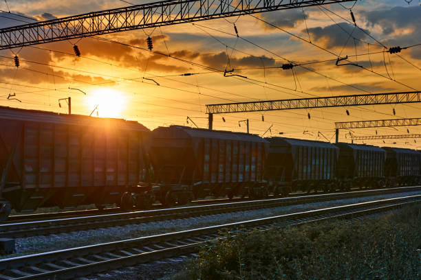istock railway and cars in a beautiful sunset, dramatic sky and sunlight 1288129703