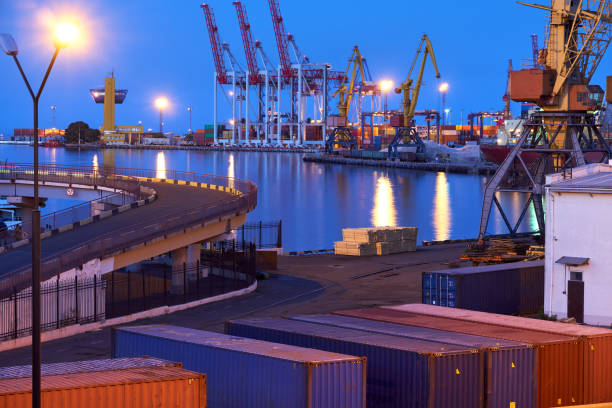 istock view of the industrial port at night - ships waiting for loading and unloading, cargo transportation by sea 1288129798