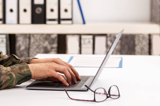istock military soldier typing on a laptop 1288132001
