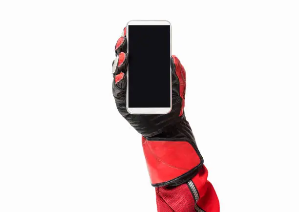 Biker hand holding smartphone with blank screen cropped image and copy space