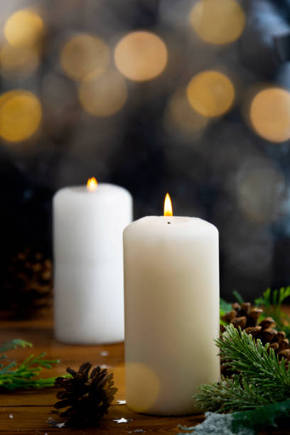 istock Christmas candles and ornaments, dark background with bokeh lights 1288136859