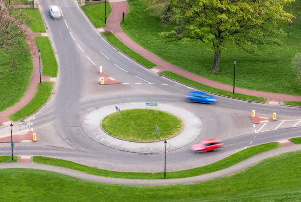 istock Cars on a roundabout 1288139088