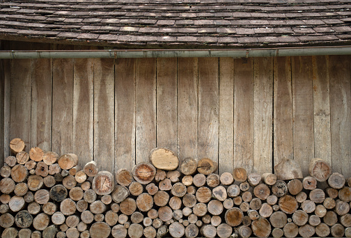 Firewood pile behing a wooden hut in Santa Catarina, Brazil.