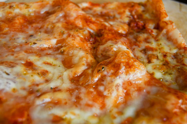 istock Close-up of a sliced pizza 1288140614