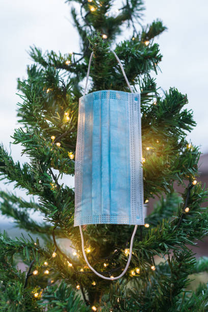 istock Christmas tree decorated with face mask 1288141670
