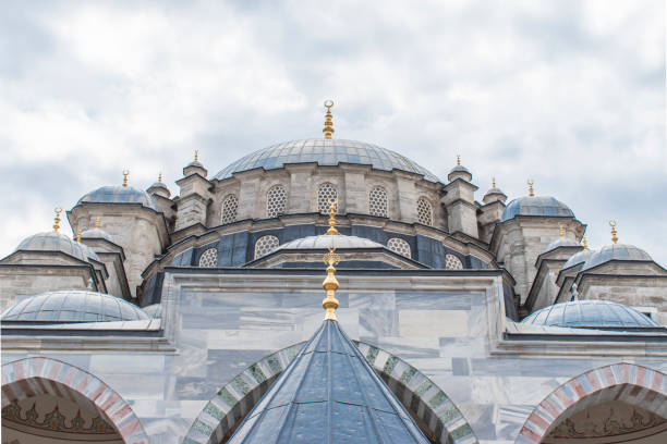 istock Fatih Mosque and Complex is a mosque and complex built by Fatih Sultan Mehmed in Fatih district of Istanbul. mosque with blue sky behind it. 1288142987