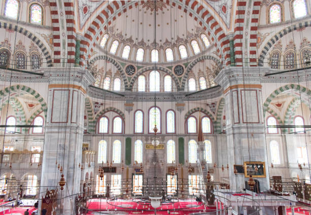 istock Istanbul , Turkey / July 2019 Fatih Mosque and Complex is a mosque and complex built by Fatih Sultan Mehmed in Fatih district of Istanbul. Interior architecture of the mosque, dome, columns and light 1288143428