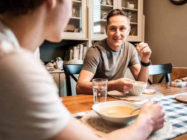 istock Father and son having lunch at home 1288144107