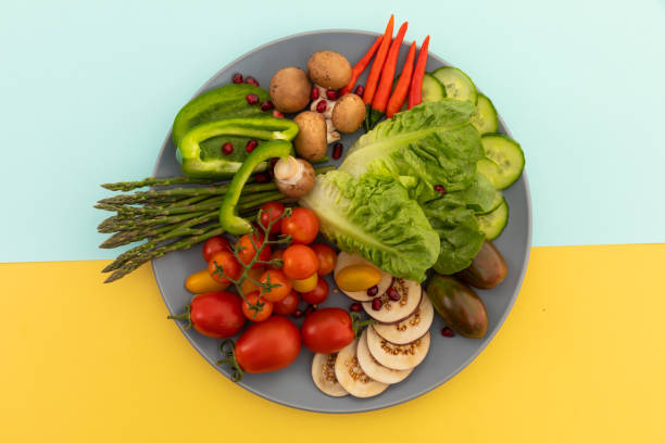 istock High angle view of freshly cut vegetables on grey plate 1288144608
