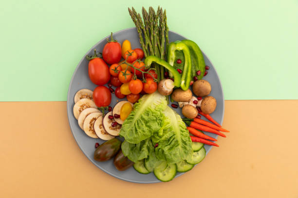 istock High angle view of freshly cut vegetables on grey plate 1288144670