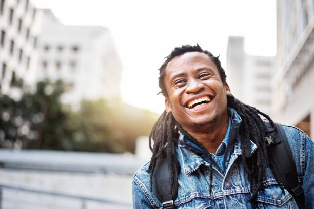 istock Happy African man smiling in the city 1288146019