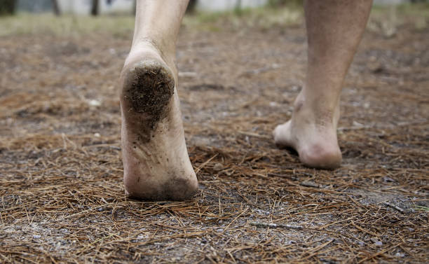 istock Dirty feet in forest 1288146906