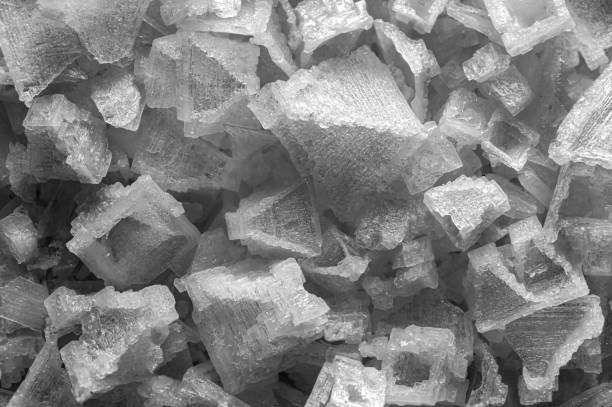 super macro shot of big white and beautyful crystals and flakes of pyramidal Indian salt in detail very close . good food background