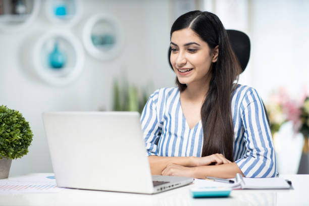 Young Business woman in office - stock photo Indian, corporate, woman, adult, office, comfortable work clothes indian stock pictures, royalty-free photos & images