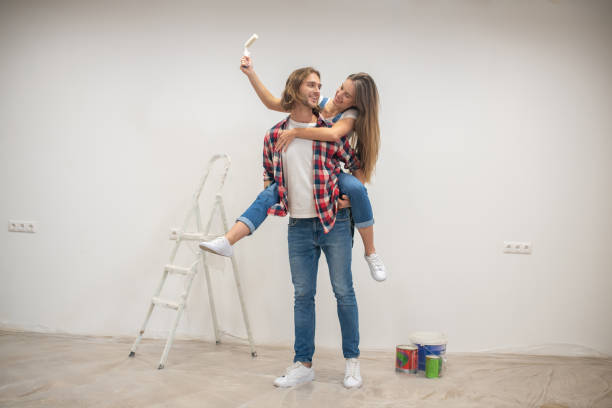 istock Young man holding his girlfriend on his back and feeling joyful 1288148777