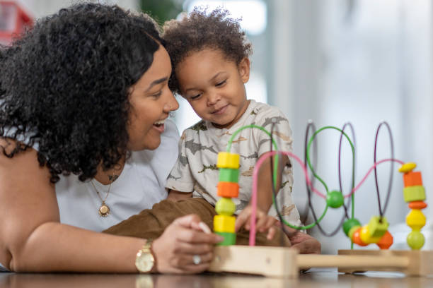 istock Toddler playing with mother 1288149047