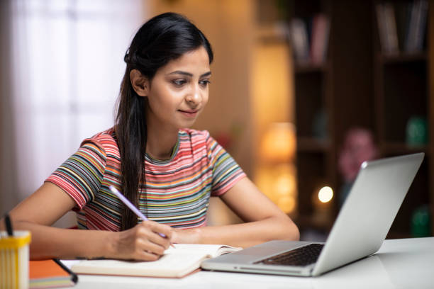 istock Young woman study at home - stock photo 1288150064