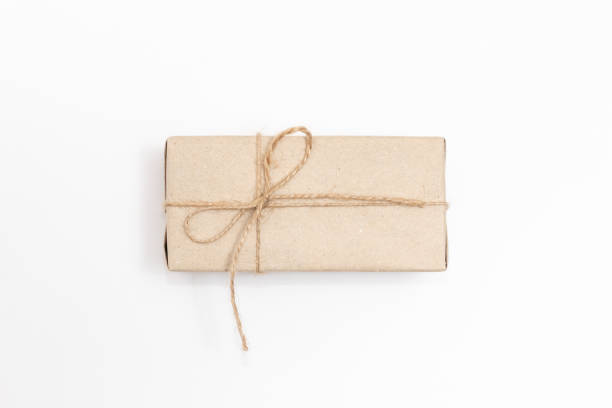 istock Gift in craft paper on a white background. 1288150825