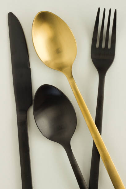 istock Black and gold cutlery, dishware 1288152087