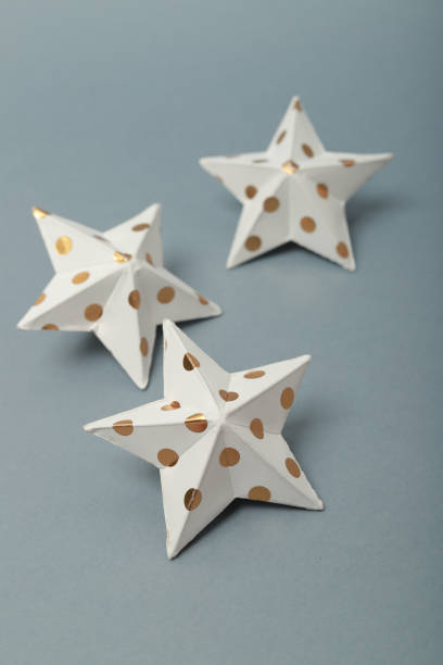 istock christmas paper stars on a blue background 1288152664