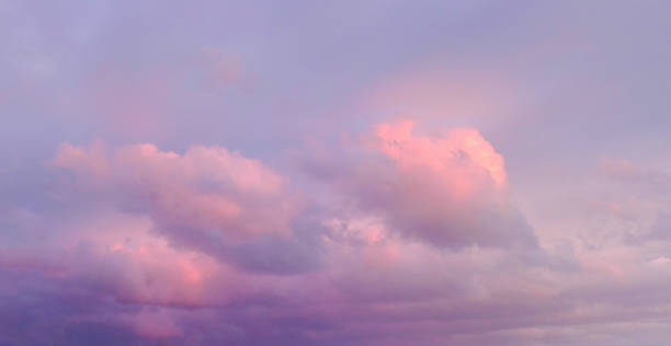 istock wallpaper romantic panorama of azure sky with pink clouds 1288155986
