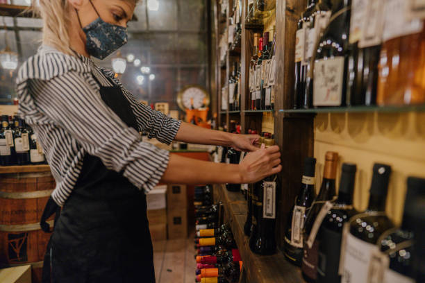 istock Woman working at a wine store during pandemic 1288156707
