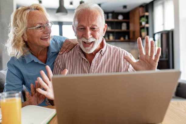 istock Happy senior couple talking on a video call 1288157954