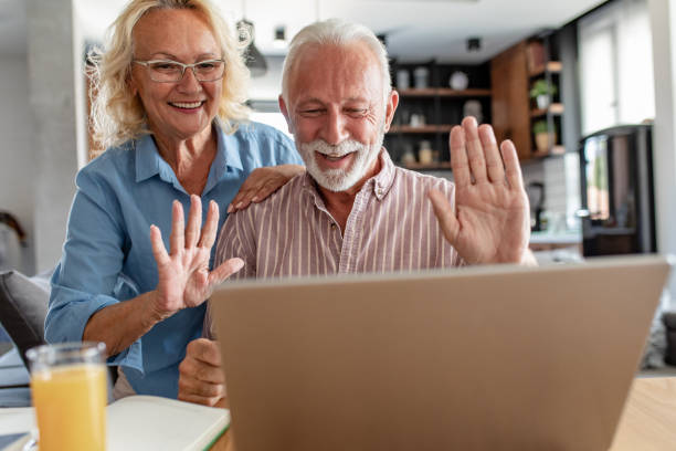 istock Happy senior couple talking on a video call 1288157958
