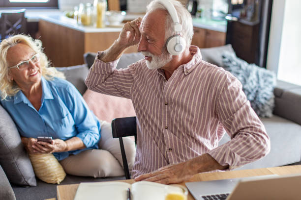 istock Senior man working on the laptop at home 1288158237