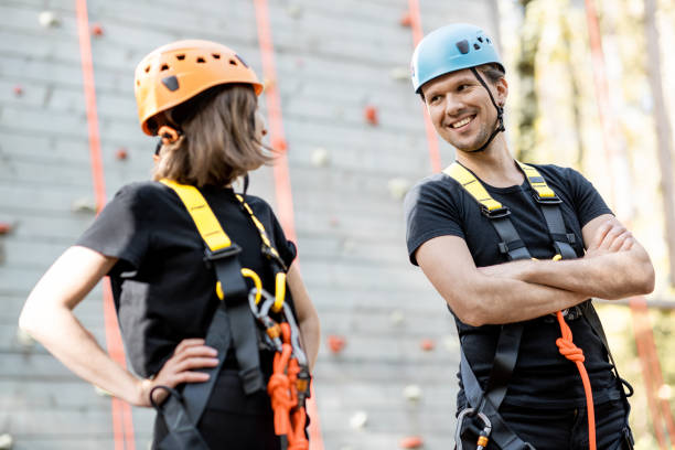 istock Well-equipped couple near the climbing wall 1288160127